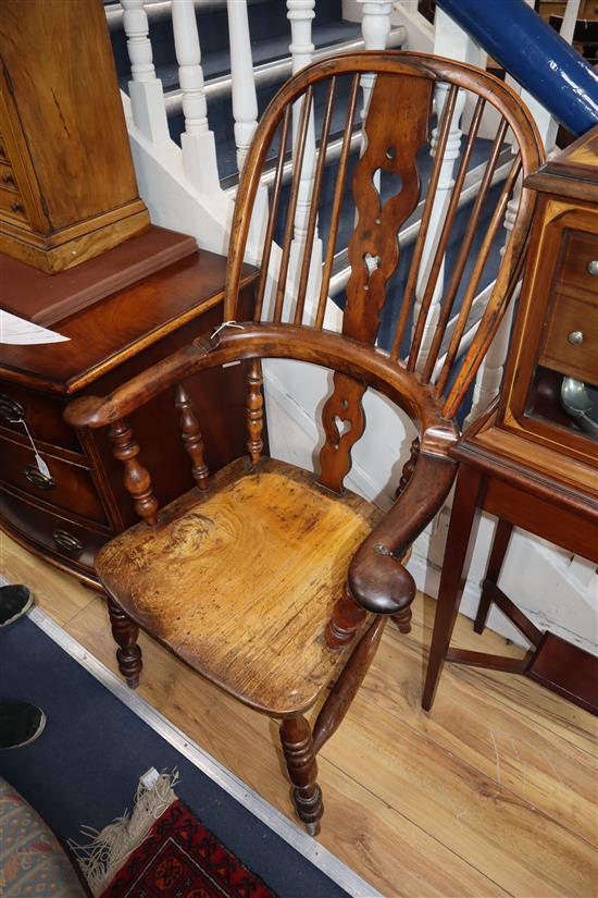 A harlequin set of six Victorian heart motif yew and elm Windsor chairs